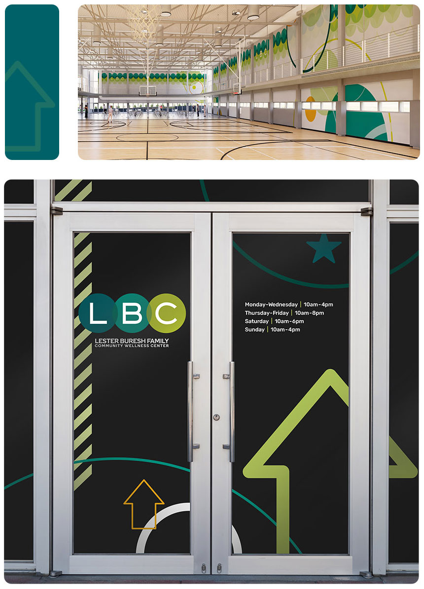 Gym and doors of the Lester Buresh Family Community Wellness Center with branding.